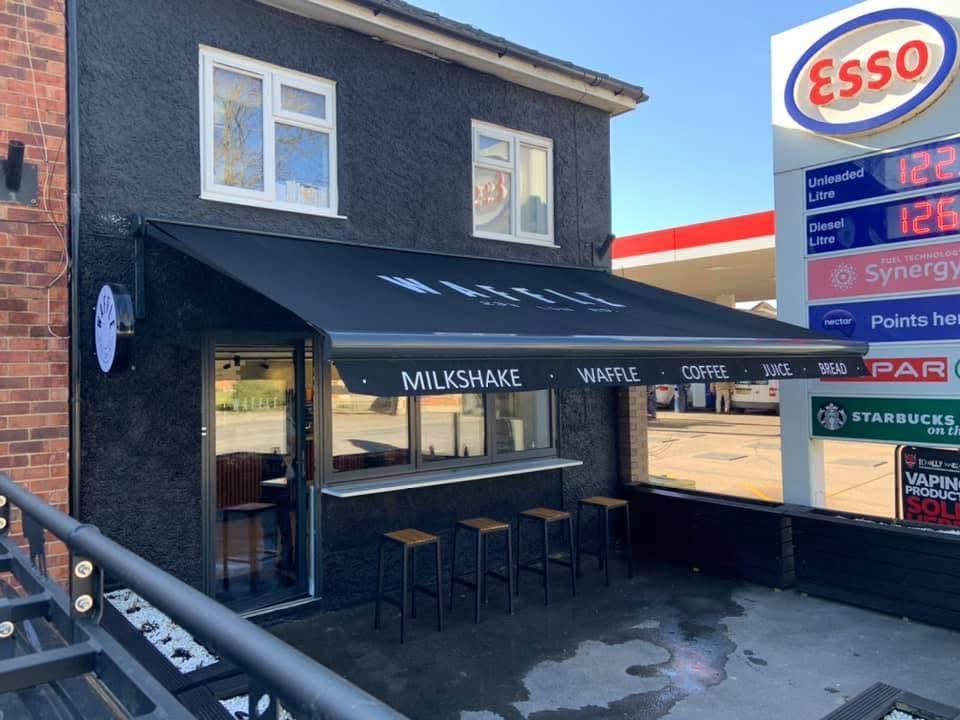 Commercial awning sign written installed by Lakeside Blinds